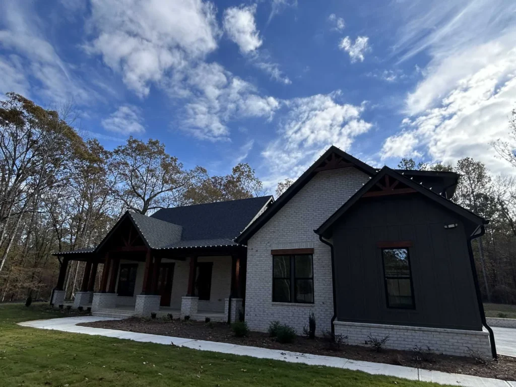 Daytime view of a modern home exterior with multiple rooflines suitable for holiday lighting design